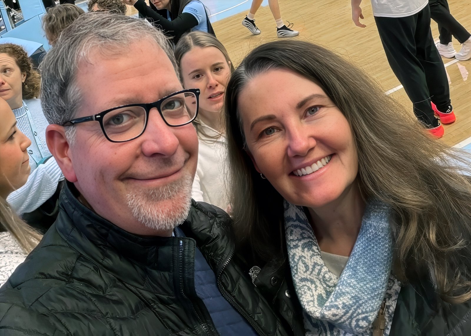Eric Haase and his wife courtside at a UNC Tar Heels game in Chapel Hill